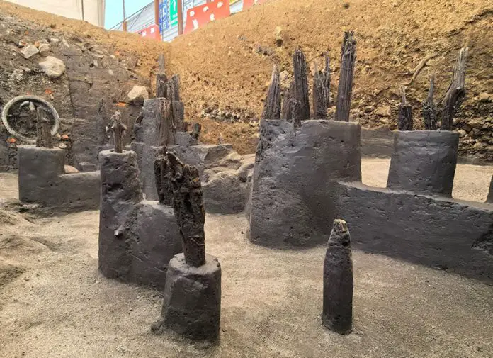 The old wooden posts of an pre-Columbian dock are visible in the hole of an archeological dig in Mexico City's Chapultepec Park