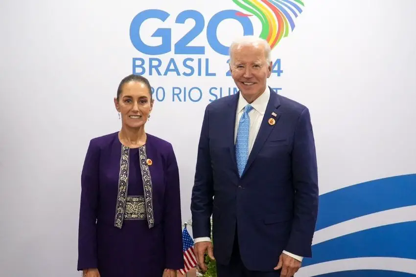 Claudia Sheinbaum and Joe Biden posing for a candid photo at the 2024 G20