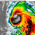 Multicolored weather map showing an image of Hurricane Rafael