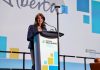 Canadian politician and Alberta Premier Danielle Smith speaks at a microphone