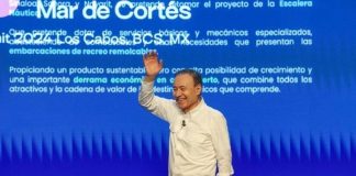 Sonora Governor Alfonso Durazo Montaño waves to audience at Mar de Cortes Forum in Los Cabos, Mexico