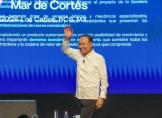 Sonora Governor Alfonso Durazo Montaño waves to audience at Mar de Cortes Forum in Los Cabos, Mexico