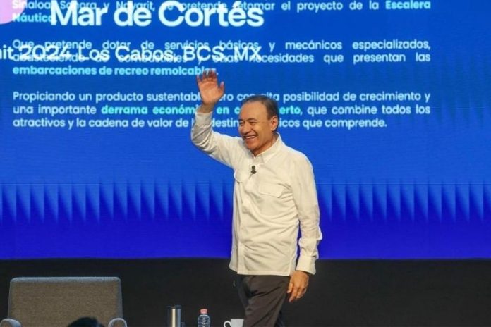 Sonora Governor Alfonso Durazo Montaño waves to audience at Mar de Cortes Forum in Los Cabos, Mexico