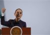 Mexico's President Claudia Sheinbaum at a podium talking to reporters about Mexico's national water plan at a press conference.