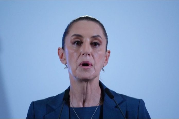 Close up of Mexico's President Sheinbaum's face in mid speech against a bokeh background