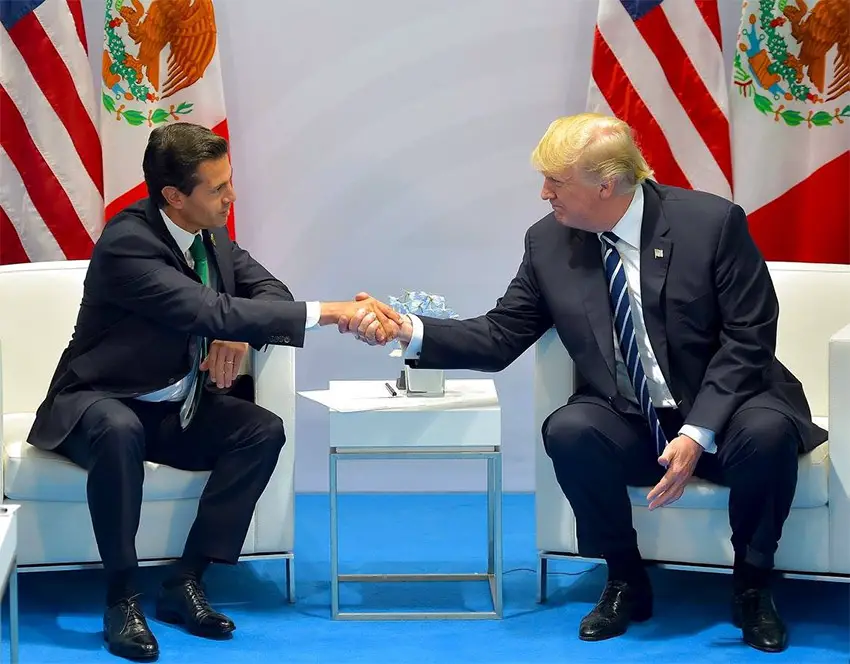 Former Mexican President Enrique Peña Nieto shakes hands with Donald Trump