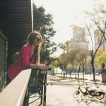 A single woman looks out over Mexico City.