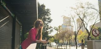 A single woman looks out over Mexico City.