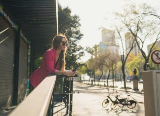 A single woman looks out over Mexico City.