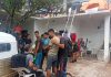 A group of migrants gather in the courtyard of a compound in Oaxaca, shortly after their rescue by government officials