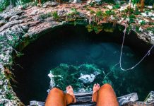 Someone entering a cenote in Mexico