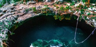 Someone entering a cenote in Mexico