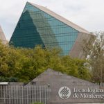 A sign reads Technológico de Monterrey, with glass and metal buildings in the background