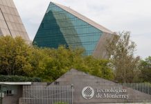 A sign reads Technológico de Monterrey, with glass and metal buildings in the background