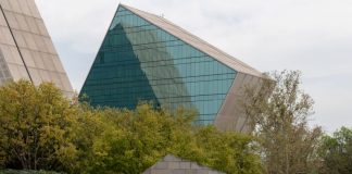 A sign reads Technológico de Monterrey, with glass and metal buildings in the background