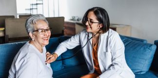 A doctor cares for an elderly patient. Healthcare in Mexico podcast