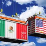 Illustration of two shipping containers hanging by cables in the air. The front of the container on stage left is painted with he flag of Mexico. The container on stage right is painted with the flag of the United States.