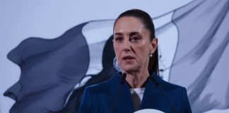Mexico's President Claudia Sheinbaum at her daily press conference in front of the presidential podium