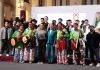 President Claudia Sheinbaum, front center, posing with a group of musicians in traditional Mexican indigenous clothing