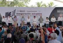 Mexico's President Claudia Sheinbaum cutting a ribbon to open the completed Guadalajara-Puerto Vallarta highway