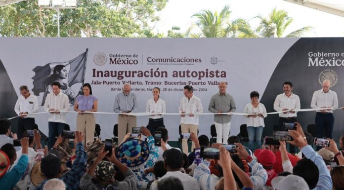 Mexico's President Claudia Sheinbaum cutting a ribbon to open the completed Guadalajara-Puerto Vallarta highway