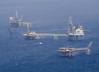 Floating rigs of a Pemex offshore oil drilling field, made possible by suppliers of goods and services