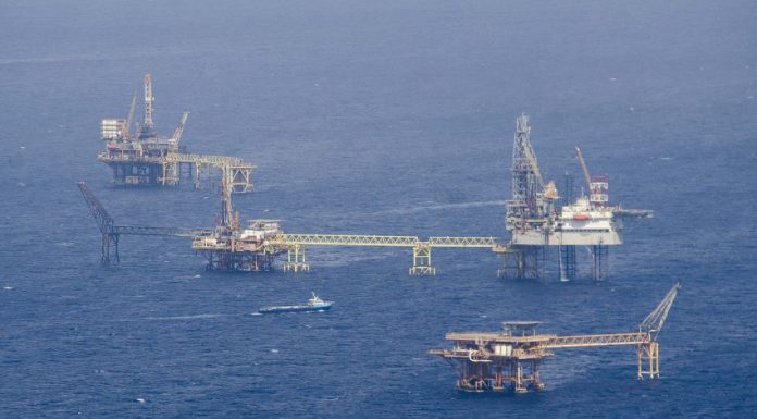 Floating rigs of a Pemex offshore oil drilling field, made possible by suppliers of goods and services