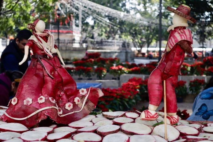 Dancers sculpted out of radishes as part of Oaxaca's Night of the Radishes