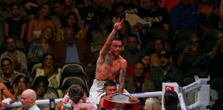 Mexican Gabriel Gollaz Valenzuela celebrates victory over Australian Steve Spark, during a boxing match held at the Akron Stadium in Zapopan.