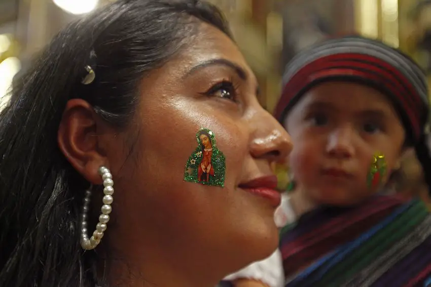 A woman with a temporary tattoo of the Virgin of Guadalupe 