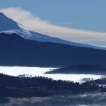 Breathtaking view of Popocatépetl and Iztaccíhuatl volcanoes covered in snow.