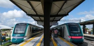 Two trains at a Maya Train station