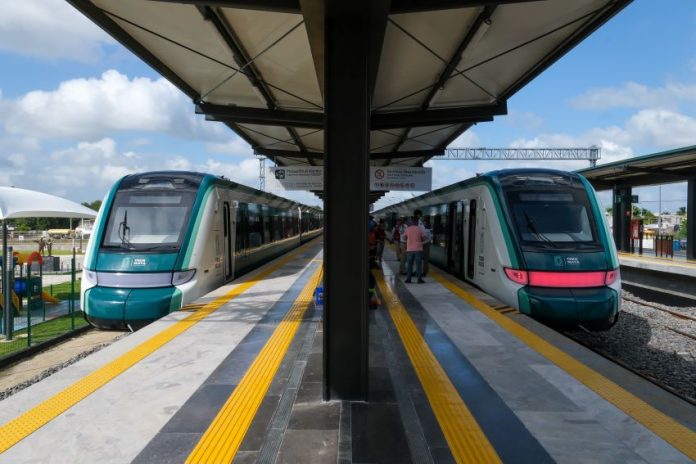 Two trains at a Maya Train station