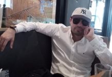 A photo of 'El Mini Lic' wearing sunglasses and a baseball cap in a US cafe, before he was arrested