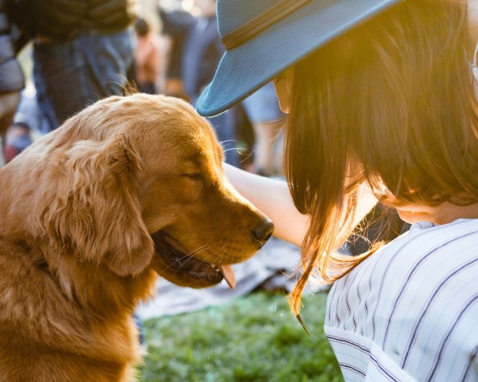 A woman and her golden retriever