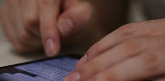 A person scrolling down through their smartphone