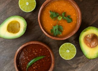 Two ceramic bowls with traditional Mexican salsas.