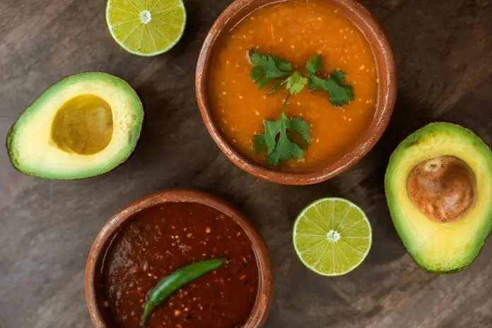 Two ceramic bowls with traditional Mexican salsas.