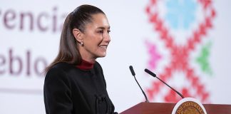 Mexican President Claudia Sheinbaum stands at a podium at her morning press conference, where she discussed a recent New York Times report on fentanyl production in Sinaloa