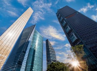 A cluster of skyscrapers climbing into a blue sky in Mexico's business district in Mexico City