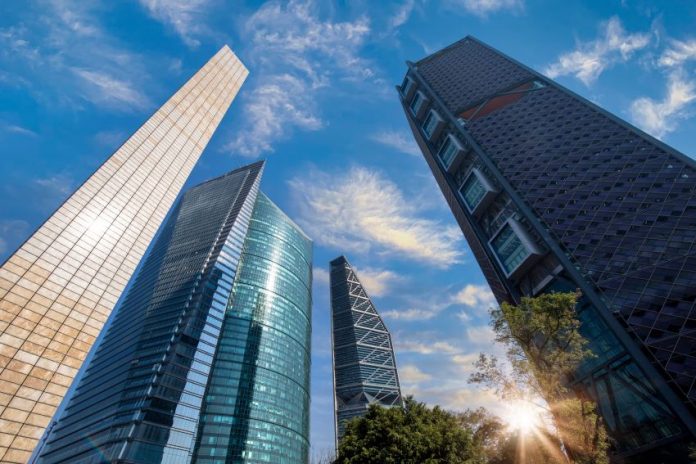 A cluster of skyscrapers climbing into a blue sky in Mexico's business district in Mexico City