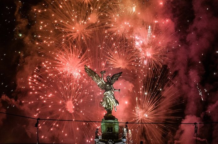 Mexico City welcomes 2013 with fireworks in Reforma Avenue.