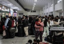 Mexicans wait for transport at the Tijuana Bus Terminal in December 2024