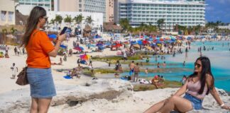 International tourists enjoying the beach in Mexico