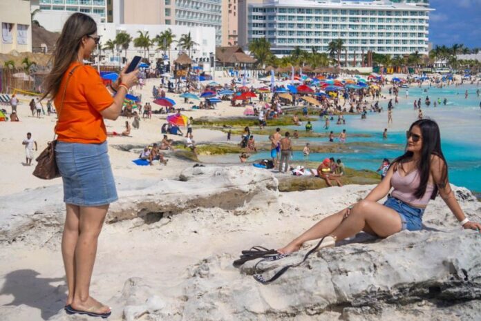 International tourists enjoying the beach in Mexico