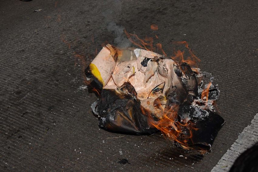 A burned Donald Trump piñata