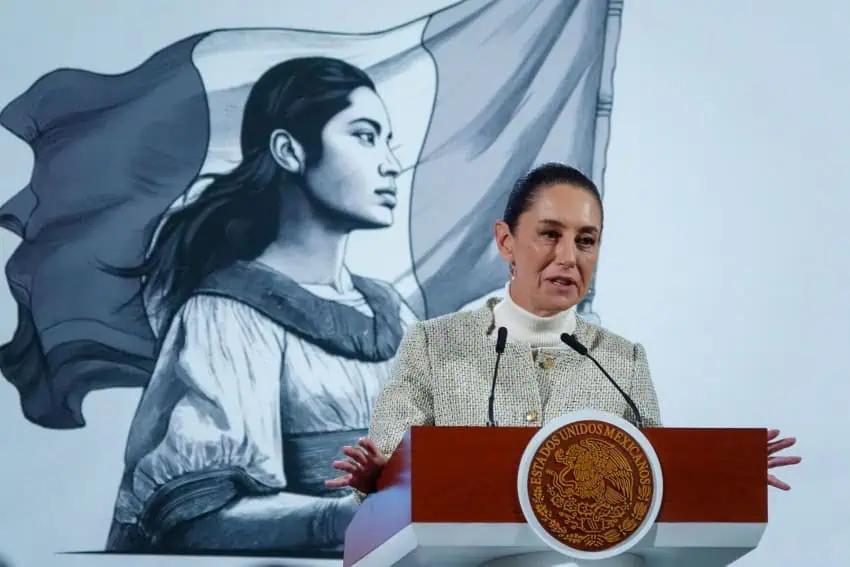 President Claudia Sheinbaum at the presidential podium during a press conference.