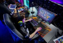 A young gamer plays a computer game, part of Phygital Games Mexico