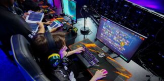 A young gamer plays a computer game, part of Phygital Games Mexico