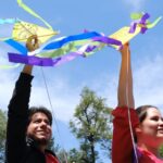 People holding kites